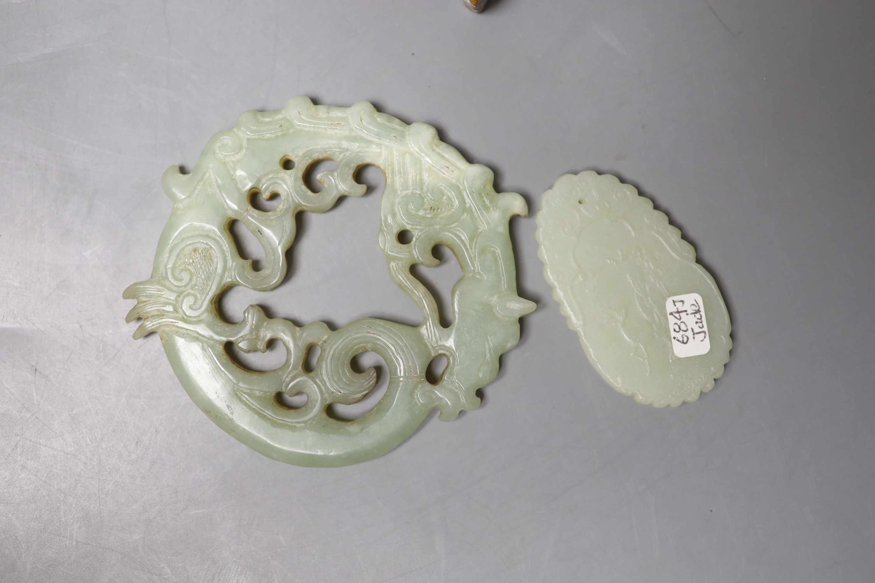 Eight Chinese jade or hardstone plaques or figures